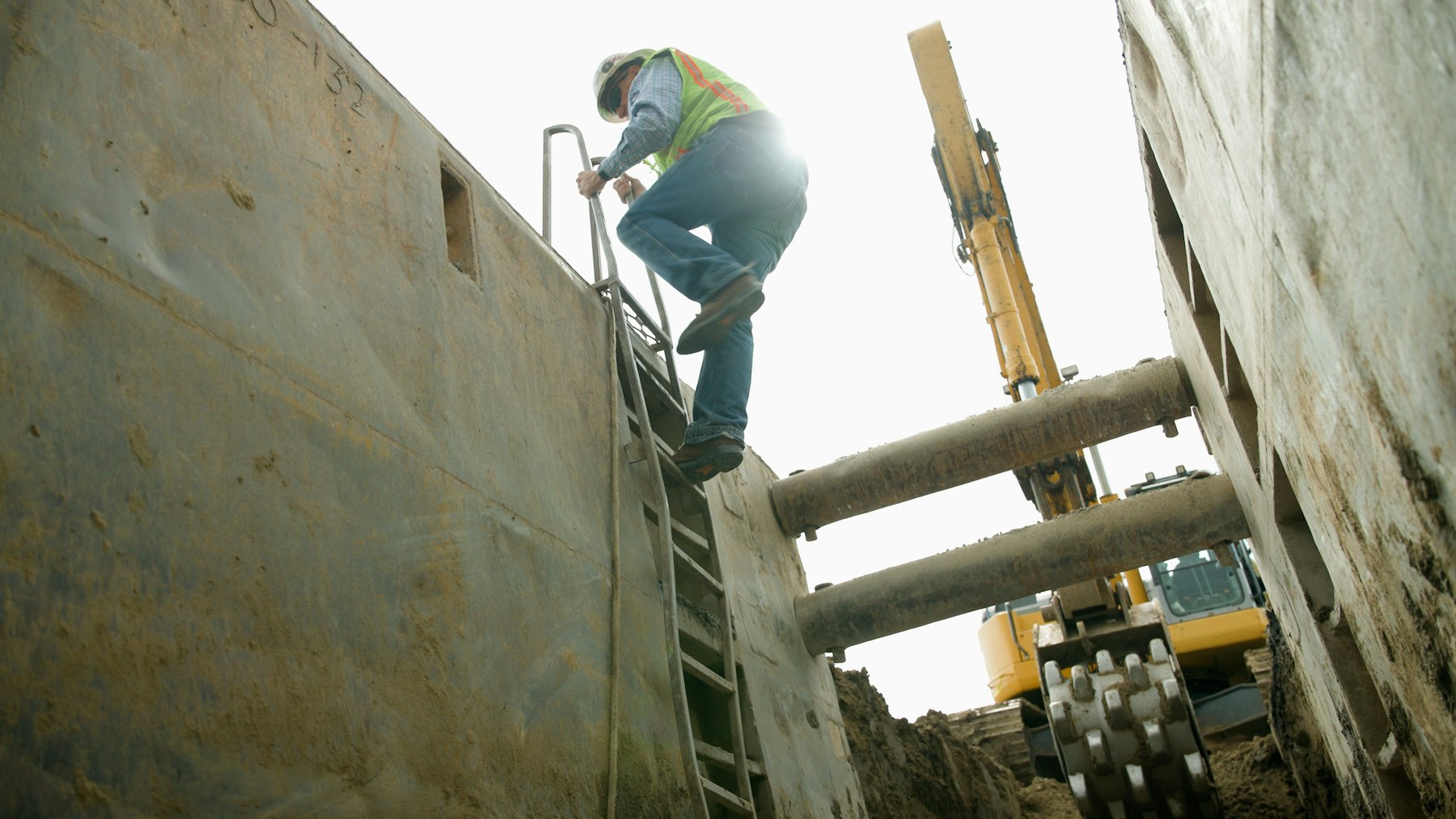 ConLit crew member working a shored trench